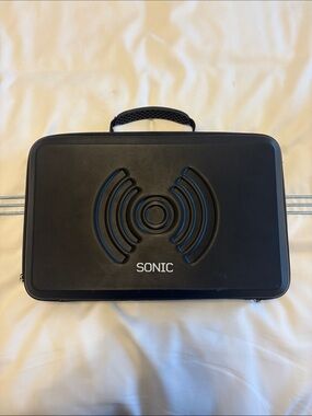 SONIC massage gun w/case. Never used
